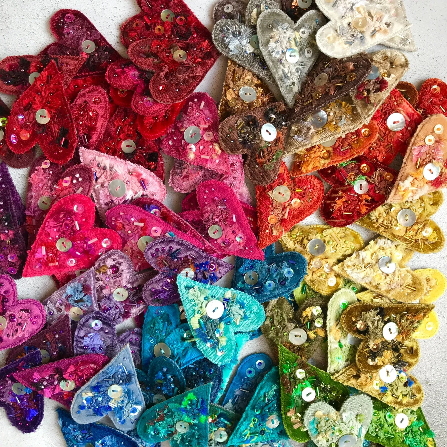 Fabric heart brooches in greens