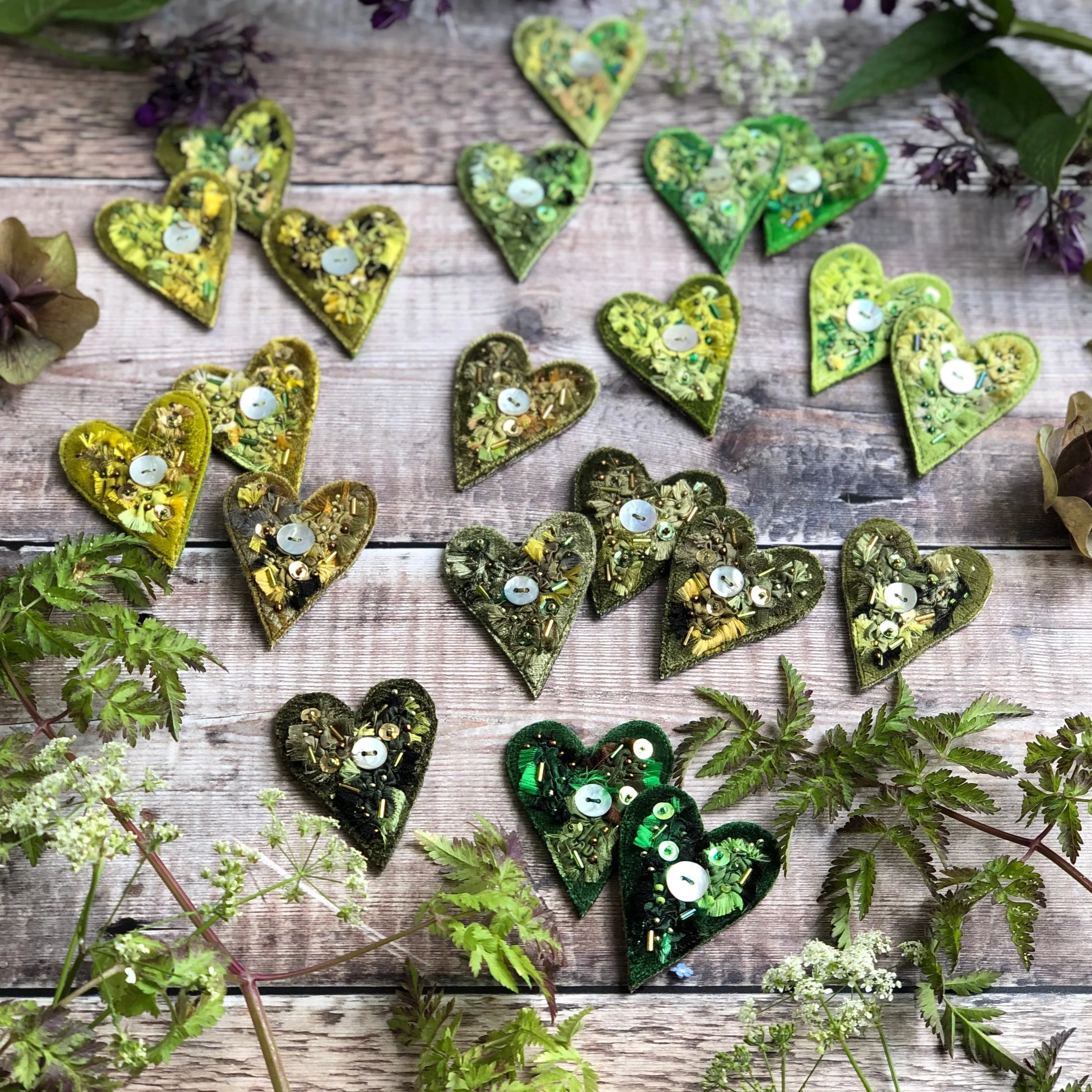 Fabric heart brooches in greens
