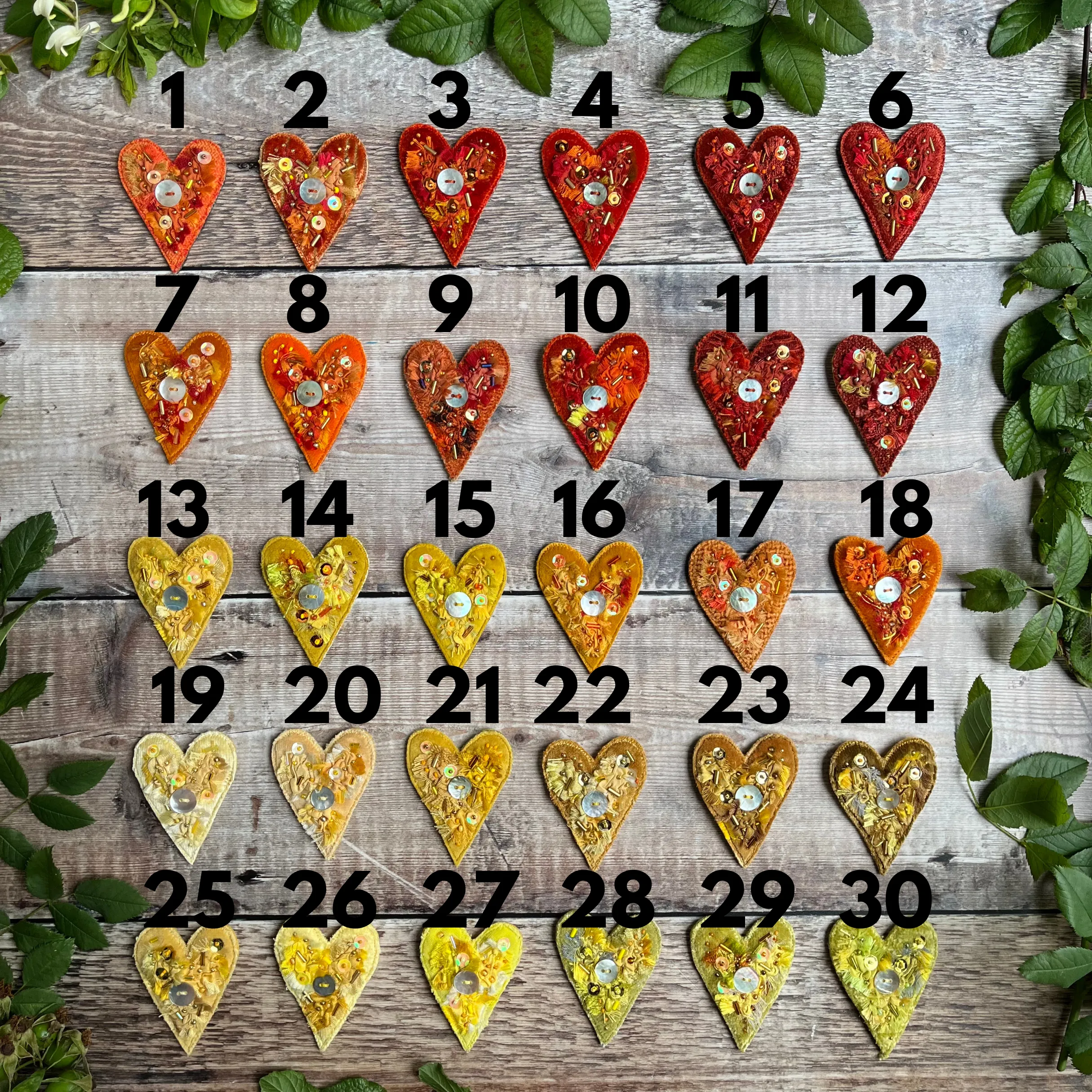 Fabric heart brooches in oranges and yellows