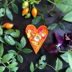 Fabric heart brooches in oranges and yellows